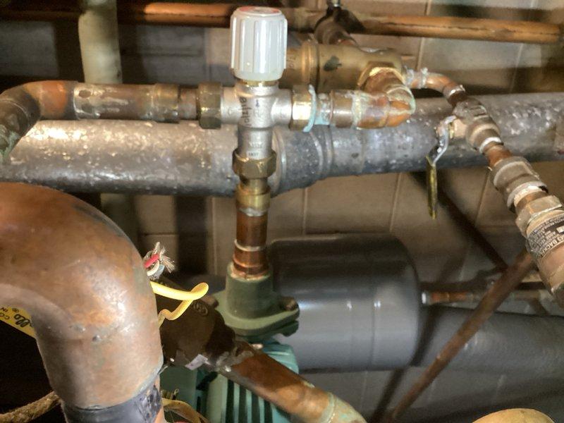 Responded to no hot water complaint with boiler running continuously. Diagnosed malfunctioning mixing valve causing improper temperature regulation between in-floor heating loops and domestic indirect tank. During indirect tank heating cycle, supply water was incorrectly heating the in-floor system due to valve failure to properly mix water to correct temperature setpoint. Provided estimate for mixing valve replacement to resolve cross-heating issue and restore proper system operation.