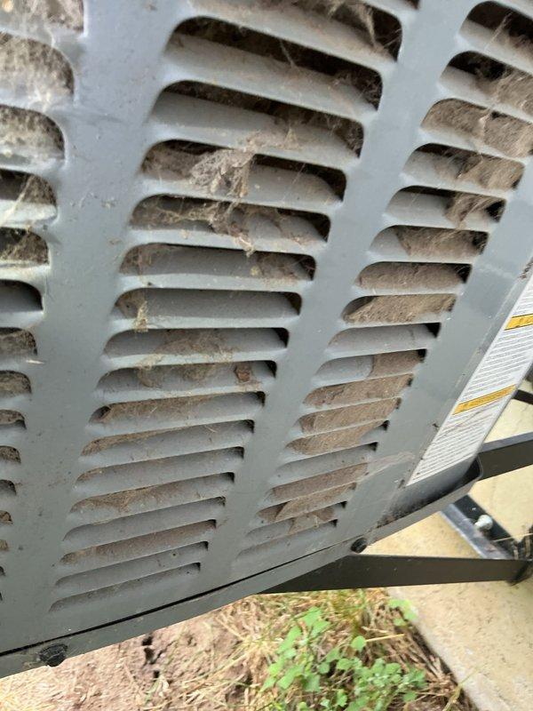 Responded to no-cool complaint on 5-year-old residential HVAC system experiencing inadequate cooling performance and inability to recover from temperature setpoint deviations. Upon arrival, performed visual inspection of outdoor condensing unit and identified heavily restricted condenser coil with significant debris accumulation blocking airflow. Documented coil condition with photographs showing dirt, dust, and cobweb buildup on louvers and fins. Homeowner declined further diagnostic testing and elected to perform condenser coil cleaning themselves based on prior experience with similar issue. System requires condenser coil cleaning to restore proper heat rejection and cooling capacity.