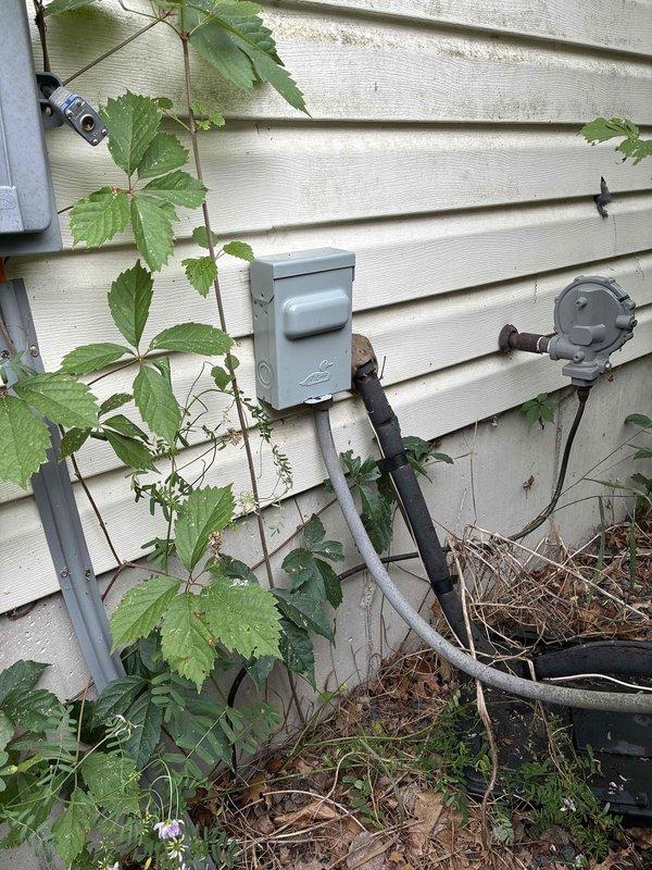 Responded to a no-cool complaint on a 2-year-old Lennox system where the outdoor fan would not activate. Diagnosed no power to the condenser unit and traced the issue to a failed breaker-style disconnect switch at the outdoor unit. The obsolete disconnect should have been replaced during the original system installation. Replaced the faulty disconnect with a new unit and restored power to the condenser. Verified system operation with an 18-degree temperature differential across the evaporator coil, confirming proper cooling performance. Noted significant vegetation overgrowth around the outdoor unit that could restrict airflow and recommended clearance for optimal system efficiency. System restored to normal operation.