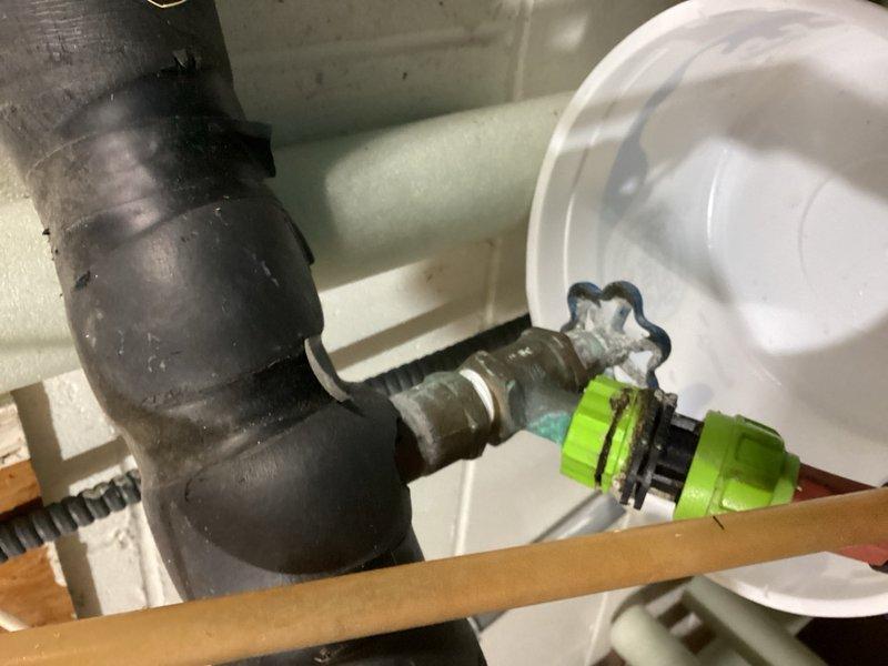 Responded to multiple plumbing issues throughout the residence. Replaced faulty Moen cartridge in upstairs shower valve to restore water flow and repair inoperable shower knob. Addressed leaking well line by repairing 1-inch copper pipe connection showing visible corrosion and oxidation. Inspected basement faucet with visible drip during irrigation system operation and verified water supply connections. Evaluated bathroom sink with crack and assessed faucet requiring replacement for future service. Inspected corroded shut-off valves and pipe fittings showing significant deterioration with rust and green patina buildup. All repairs completed without requiring main water shutoff to the property. Documented conditions of plumbing components including aged metallic valves, flexible connectors, and corroded pipe joints for maintenance records.