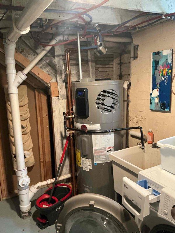 Responded to no cooling complaint on 13-year-old Tempstar air conditioning system that had been running continuously for four hours with minimal temperature reduction. Upon arrival, conducted comprehensive system diagnostics and found multiple critical issues affecting cooling performance. System was operating with low refrigerant charge, resulting in inadequate cooling capacity. Temperature drop across evaporator coil measured 14 degrees, which is below manufacturer specification of approximately 20 degrees, confirming insufficient refrigerant levels. 

Performed electrical component testing and discovered dual capacitor showing signs of failure, which affects both compressor and condenser fan motor operation. Further inspection revealed condenser fan motor exhibiting early signs of seizure, presenting risk of complete motor failure and potential system shutdown. Documented all findings with photographic evidence of indoor air handler and mechanical systems. Reviewed all available rep