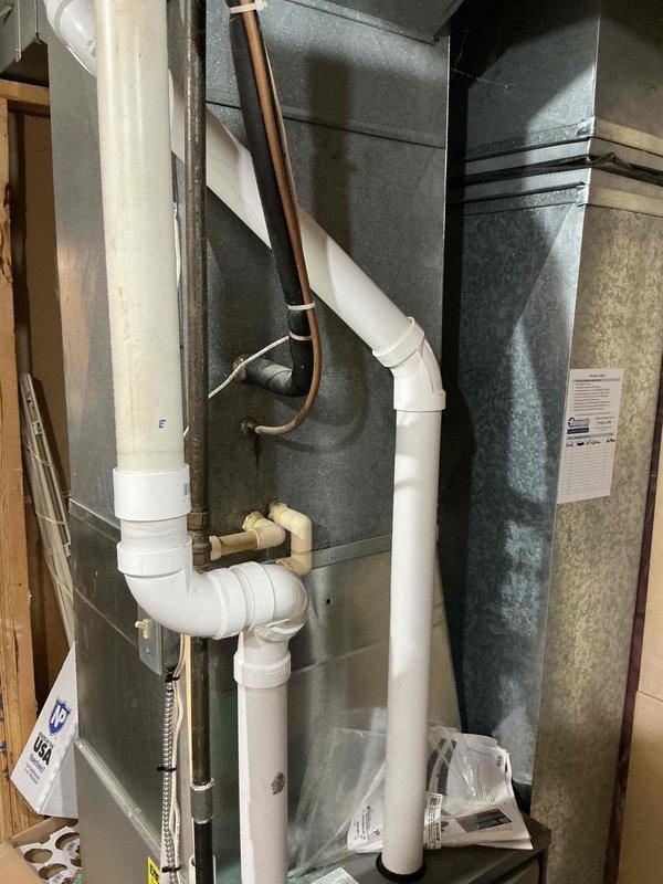 Performed comprehensive AC tune-up on existing system, including cleaning of routine components, filter inspection, and testing of all equipment. Removed dead mouse from unit, cleaned and secured electrical wiring connections, and verified proper system operation. Documented equipment make, model, and serial numbers with photographs for maintenance records.