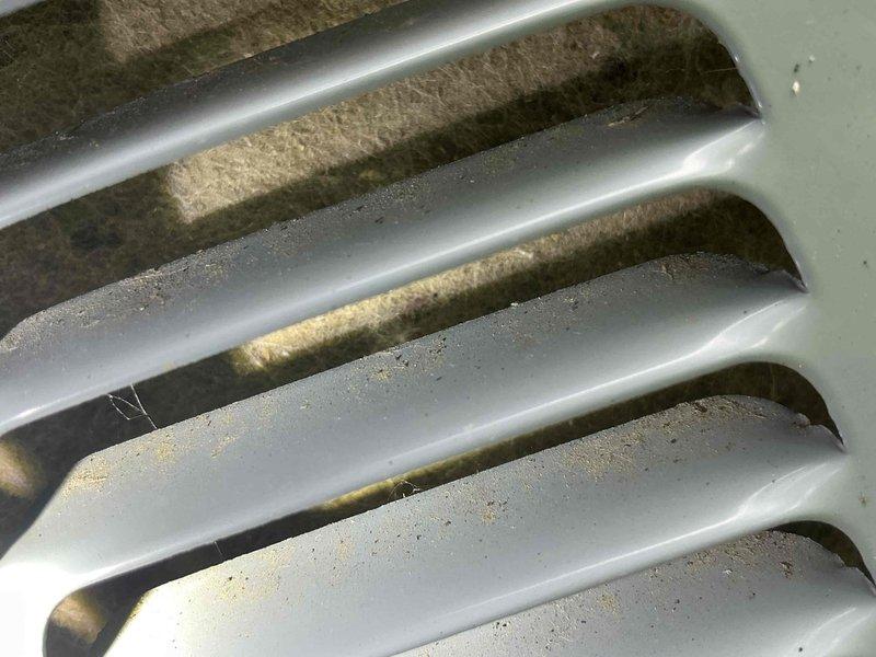 Responded to no cooling complaint on 8-year-old residential air conditioning system. Upon inspection, diagnosed low refrigerant charge and heavily restricted outdoor condenser coil with significant dirt and debris accumulation between fins. Thoroughly cleaned condenser coil to restore proper airflow and heat transfer capability. Added refrigerant to bring system to proper operating charge. Verified system operation and confirmed adequate cooling performance upon completion.
