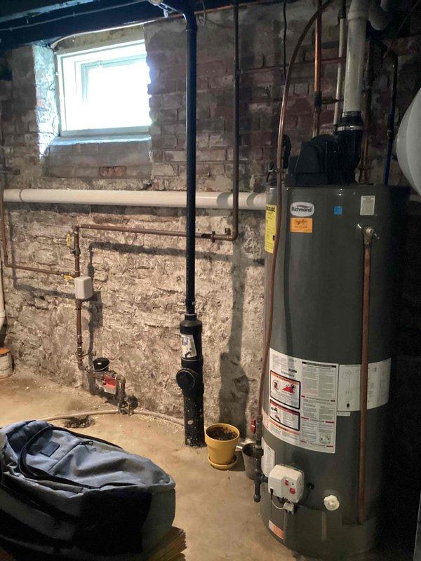 Responded to multiple shower-related issues including a slow leak from the master shower, low water pressure in a secondary shower, and a malfunctioning shower valve. Upon inspection, determined the shower cartridge was defective and the entire valve assembly was not functioning properly. Replaced the faulty shower cartridge and valve system. Addressed deteriorating tile grout in the shower area that was contributing to water leakage. Additionally, installed a handheld shower head unit in the basement shower as requested. Documented existing plumbing infrastructure including water heater and supply lines. All fixtures tested and confirmed operational upon completion.
