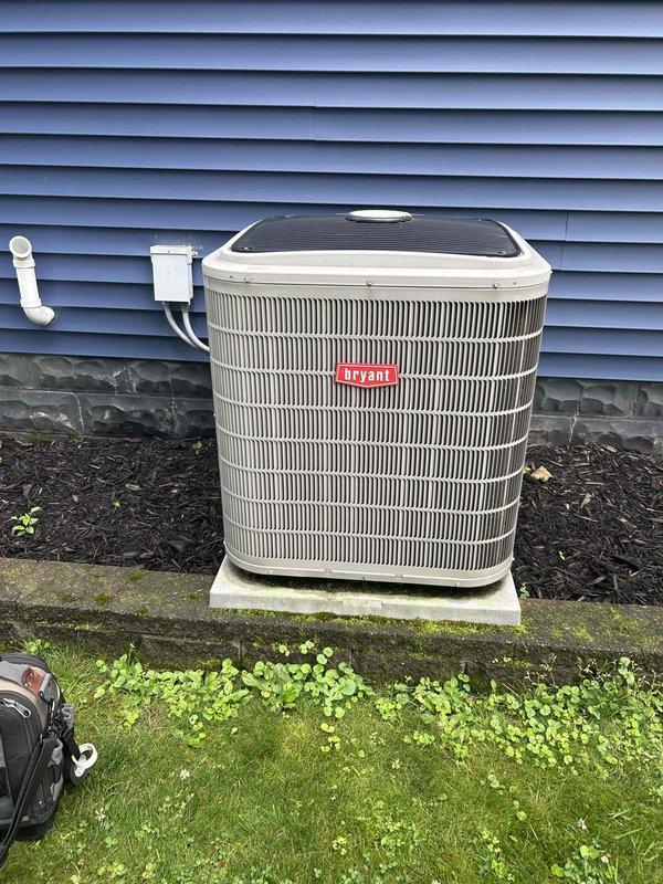Completed comprehensive AC tune-up on Bryant condensing unit in response to complaint of system running continuously. Performed full system diagnostics and found unit operating with low refrigerant charge, measuring 7°F subcooling against target of 10°F and 13°F delta T across evaporator coil. Provided quote for adding one pound of R-410A refrigerant to restore proper system charge; homeowner elected to defer refrigerant service at this time. Scheduled follow-up appointment to provide estimate for additional ductwork installation to kitchen area. Documented system conditions with photos of outdoor condensing unit and basement mechanical equipment.