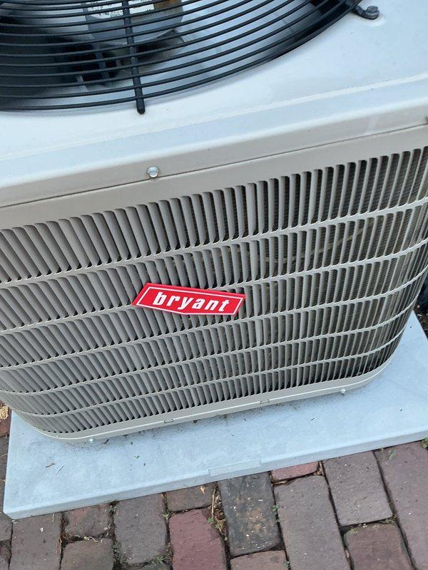 Completed annual air conditioning maintenance tune-up on Bryant outdoor condensing unit. During inspection, identified weak capacitor and low refrigerant charge. Replaced defective capacitor, recharged system to manufacturer specifications, and added UV dye for future leak detection. Inspected air filter showing normal accumulation. System operating within normal parameters upon completion.