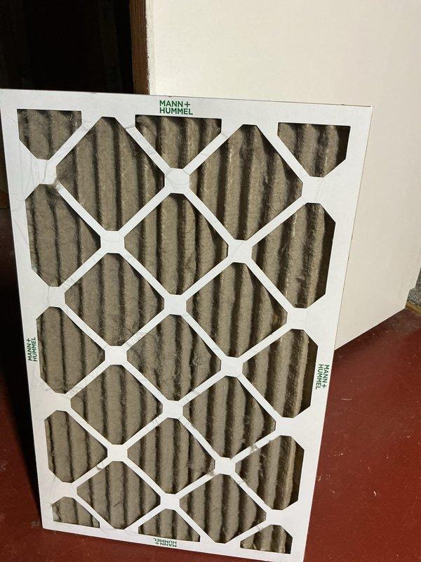 Completed annual air conditioning maintenance tune-up on Bryant outdoor condensing unit. During inspection, identified weak capacitor and low refrigerant charge. Replaced defective capacitor, recharged system to manufacturer specifications, and added UV dye for future leak detection. Inspected air filter showing normal accumulation. System operating within normal parameters upon completion.