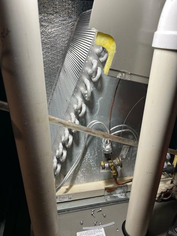 Completed comprehensive AC tune-up maintenance agreement including filter replacement, blower inspection, and evaporator coil evaluation which was found clean and draining properly. Performed routine electrical component inspection on outdoor unit, cleaned condenser coils, and conducted operational testing with 15-minute run cycle confirming proper system performance with 17-18 degree temperature differential. Addressed customer concerns regarding window condensation, explaining that current high humidity levels make condensation difficult to avoid, and confirmed all equipment operating within normal parameters.