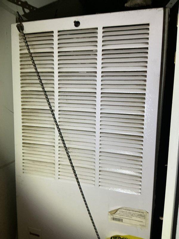 Completed AC maintenance on a 20-year-old R-22 system in a manufactured home. Found significant dirt and debris accumulation throughout the air handler, blower motor leaking oil, and measured a 15-degree temperature split across the evaporator coil. High-side service port was inaccessible due to burial in sand, preventing complete refrigerant pressure diagnostics. Provided guidance on proper filter installation and sizing for the return air grille, as the unit had been operating without filtration since purchase. Recommended blower motor replacement due to oil leakage and comfort advisor consultation for system evaluation given the age of equipment and R-22 refrigerant phase-out considerations.