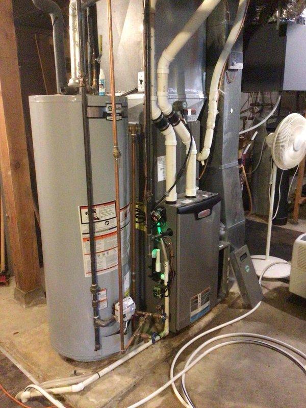 Completed comprehensive AC tune-up on Lennox system. Identified and resolved condensate drainage issue caused by pinched hose at furnace corner—repositioned hose to eliminate restriction and restore proper drainage flow. Performed outdoor unit cleaning, conducted electrical testing with all readings within manufacturer specifications, and verified system performance with 20-degree temperature split across coil.