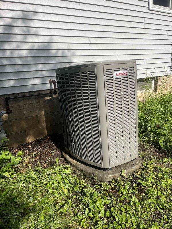 Completed comprehensive AC tune-up on Lennox system. Identified and resolved condensate drainage issue caused by pinched hose at furnace corner—repositioned hose to eliminate restriction and restore proper drainage flow. Performed outdoor unit cleaning, conducted electrical testing with all readings within manufacturer specifications, and verified system performance with 20-degree temperature split across coil.
