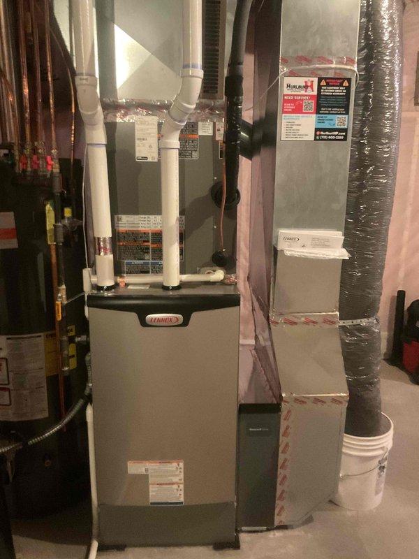 Responded to callback for pilot light issues on two fireplaces after recent HVAC system installation where gas supply had been shut off during the installation process. Successfully relit pilot lights on both fireplace units and verified proper operation. System documentation photos captured showing Lennox furnace installation, air handler with ductwork, and associated mechanical equipment in utility space.