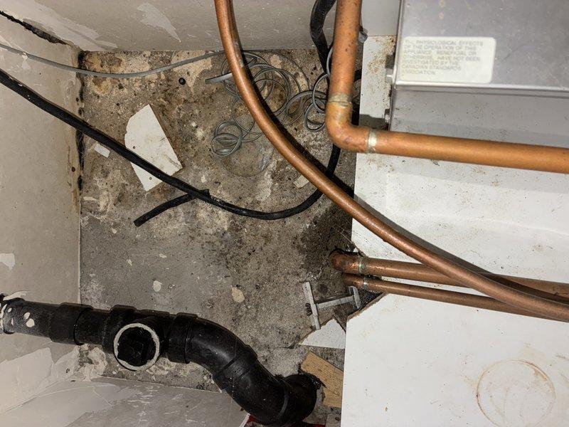 Inspected 20-year-old steam shower unit with steam leaking into adjacent closet. Identified compromised piping connections at steam generator inlet and outlet as source of leak. Due to age of unit and multiple existing issues with the system, recommended complete replacement of steam shower unit rather than repair of deteriorating pipe connections.