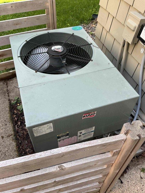 Performed maintenance inspection on residential ducted mini split system and central air conditioning unit. Replaced air filter on mini split system, cleaned outdoor coil, and verified proper operation with 24-degree temperature differential. Mini split system found to be in good working condition.

Inspected Ruud central AC system and identified multiple concerns requiring attention. Capacitor tested out of specification range. Contactor exhibited pitting and burn marks indicating electrical degradation. Condenser coil found heavily soiled with debris accumulation. Refrigerant service ports had thread sealer applied, preventing gauge connection for pressure testing and raising concern about potential refrigerant leak history. System currently achieving 18-degree temperature split, which falls at lower acceptable threshold. Heavy condenser coil contamination may be masking refrigerant undercharge condition. Documented findings with photos of outdoor unit and capacitor. Reviewed repair 