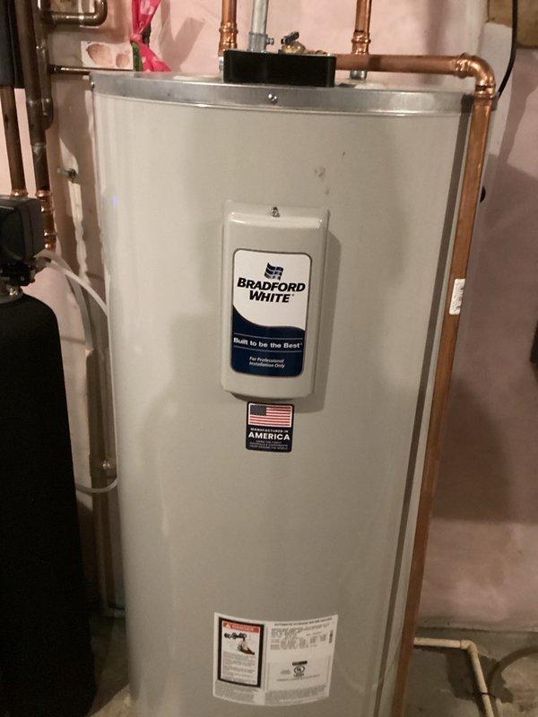 Completed comprehensive plumbing inspection as part of recurring preventive maintenance program. Inspected bathroom fixtures including single-handle chrome faucet and sink assembly, confirming proper operation and no visible leaks. Examined Bradford White residential water heater installation, verified proper copper piping connections, and confirmed unit is functioning within normal parameters with no issues detected.