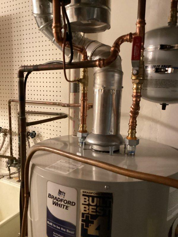 Completed air conditioner tune-up maintenance in conjunction with water heater installation. Identified and replaced weakening capacitor on condenser fan motor and faulty furnace door safety switch to ensure proper system operation and safety compliance.