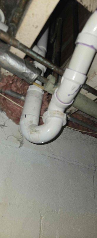 Responded to plumbing emergency involving leaking pipes behind toilet that were causing water infiltration into basement during use. Upon inspection, identified compromised drain piping and a previously failed repair attempt. Removed defective pipe section and installed new PVC drainage components including proper P-trap configuration in crawlspace area. Replaced damaged piping segment to restore watertight integrity and prevent further basement water damage. System tested and verified leak-free operation upon completion.