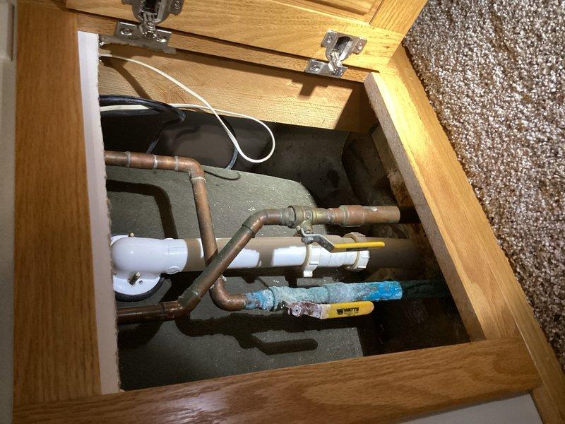 Responded to water leak originating from upstairs bathroom that was penetrating through the ceiling into the dining room below. Upon inspection, identified a faulty ball valve in the plumbing system as the source of the leak. Accessed the plumbing infrastructure through the floor access panel and successfully replaced the defective ball valve with a new unit. Tested the system to confirm proper operation and verified no further leakage was present.