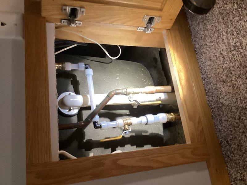 Responded to water leak originating from upstairs bathroom that was penetrating through the ceiling into the dining room below. Upon inspection, identified a faulty ball valve in the plumbing system as the source of the leak. Accessed the plumbing infrastructure through the floor access panel and successfully replaced the defective ball valve with a new unit. Tested the system to confirm proper operation and verified no further leakage was present.