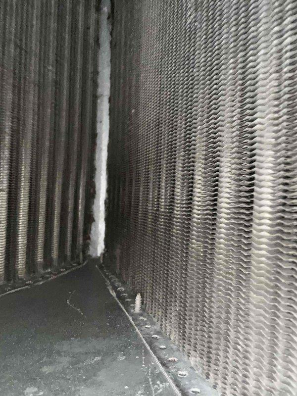 Responded to no cooling complaint on 8-year-old residential AC system. Upon diagnosis, found unit low on refrigerant charge. Contacted homeowner to discuss repair options and potential future concerns regarding the refrigerant loss. Homeowner authorized immediate repair to restore cooling. Added 2 pounds of R-410A refrigerant and injected UV dye into system to aid in future leak detection. Verified system operation with 15° temperature split across evaporator coil, confirming adequate cooling performance. System returned to normal operation.