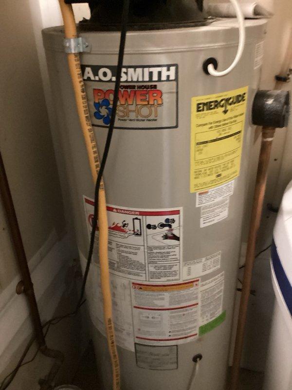 Responded to no hot water complaint on 22-year-old A.O. Smith Power Shot 40-gallon gas power vent water heater. Upon arrival, confirmed unit was not producing hot water throughout the home. Performed system reset on the water heater, which successfully restored heating function. Advised customer that given the advanced age of the unit, replacement through their home warranty company would be recommended for long-term reliability.