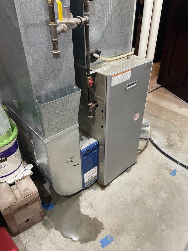 Responded to service call for furnace leaking water in basement. Upon inspection, identified water leakage originating from a frozen evaporator coil that had melted. Checked refrigerant charge and confirmed system was operating low on refrigerant. Performed AC unit inspection and identified need for refrigerant fill and leak search procedure. Advised homeowner that this furnace model has known issues with secondary heat exchanger failure. Due to age of equipment (19 years) and current system conditions, recommended full system replacement evaluation. Scheduled equipment replacement estimate appointment for following Tuesday to discuss new HVAC installation options.