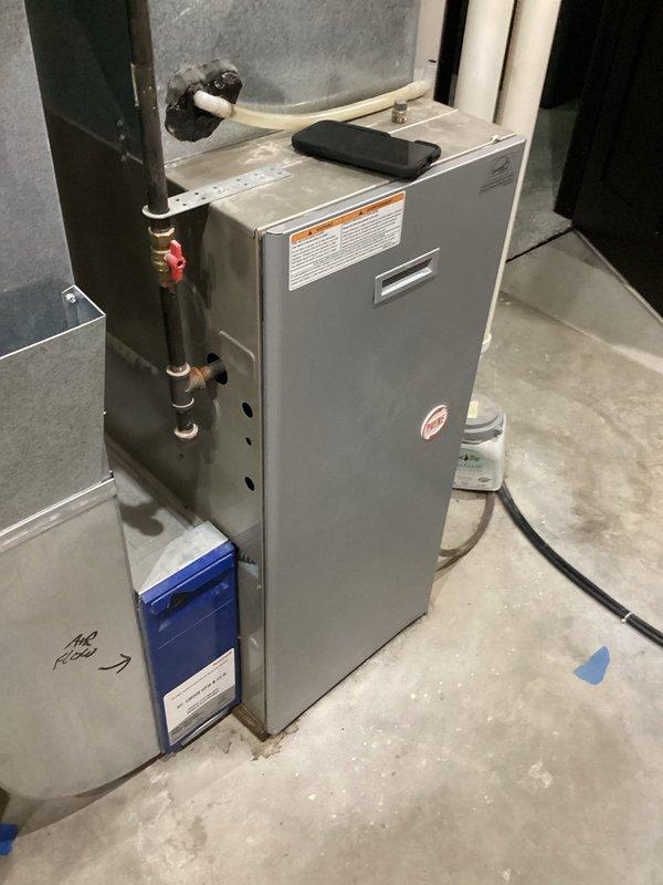 Responded to service call for furnace leaking water in basement. Upon inspection, identified water leakage originating from a frozen evaporator coil that had melted. Checked refrigerant charge and confirmed system was operating low on refrigerant. Performed AC unit inspection and identified need for refrigerant fill and leak search procedure. Advised homeowner that this furnace model has known issues with secondary heat exchanger failure. Due to age of equipment (19 years) and current system conditions, recommended full system replacement evaluation. Scheduled equipment replacement estimate appointment for following Tuesday to discuss new HVAC installation options.