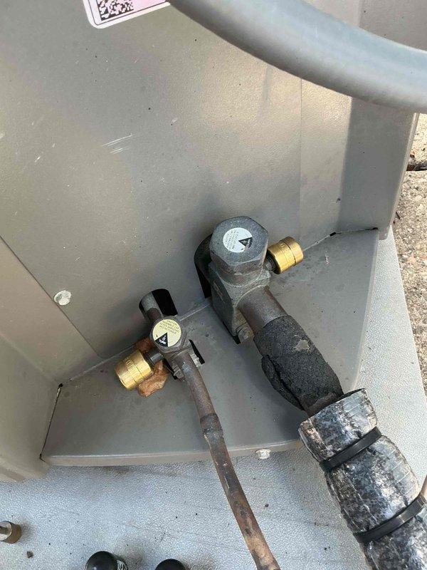Completed annual air conditioning maintenance and inspection on outdoor condensing unit. Found condenser coil heavily plugged with dirt and debris, restricting airflow and reducing system efficiency. Performed thorough solvent cleaning of condenser coil to restore proper heat transfer capability. Installed locking refrigerant line caps on service ports to prevent tampering and refrigerant loss. Inspected all electrical connections, refrigerant lines, and plumbing components for proper operation and secure mounting. Unit returned to normal operating condition with improved airflow through condenser coil.