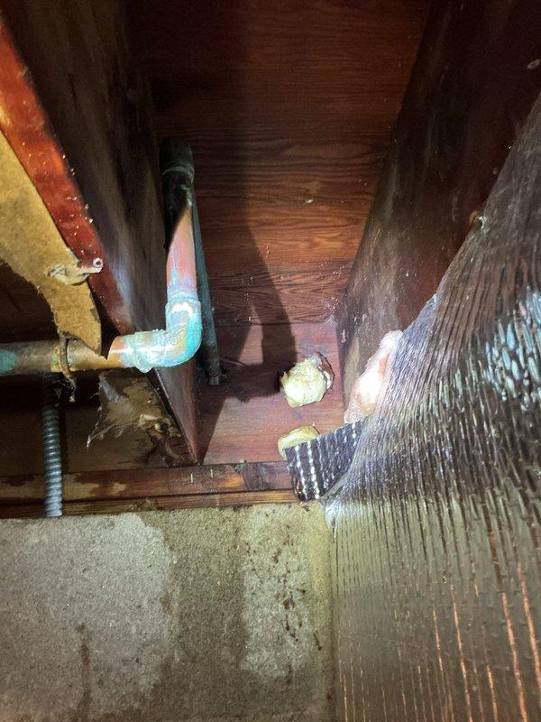 Responded to a water leak emergency in the crawl space where the main water line enters the home. Upon arrival, the water supply was already shut off. Located a pinhole leak in 3/4" copper piping between the main crawl space and equipment room. Removed the damaged section and replaced approximately 3 feet of copper pipe with new material, installing four fittings to complete the repair. Tested the system for proper operation and verified no additional leaks were present before restoring water service to the residence.