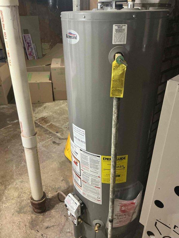 Responded to no cooling call on 13-year-old residential air conditioning system. Upon arrival, tenant reported unit made loud noise prior to failure and had hosed down the condenser. Diagnostic testing revealed compressor overload protector stuck in open position, preventing compressor operation. Verified compressor temperature was normal to touch and attempted to obtain amperage reading, but compressor failed to start. System inspection identified complete loss of refrigerant charge. Based on tenant report of effective cooling operation one week prior to failure, assessment indicates probable large refrigerant leak in system. Reviewed repair and replacement options with property owner and scheduled follow-up consultation with service advisor for further recommendations.