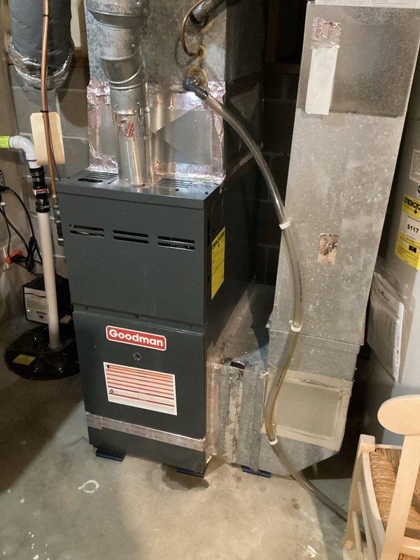 Responded to report of water leaking from furnace vent pipe. Upon arrival, no active water leak was observed. Investigated potential sources and determined condensation from air conditioning system operation and minor condensation from overhead cold water line were likely causes of small water accumulation previously observed. Checked refrigerant pressures on R22 system and found levels off but not critically low, ruling out coil freeze-up. System appears to be overfeeding refrigerant, noted replacement condenser installed in 2014 with unknown evaporator coil age. Documented equipment conditions with photos and provided quote for system corrections.