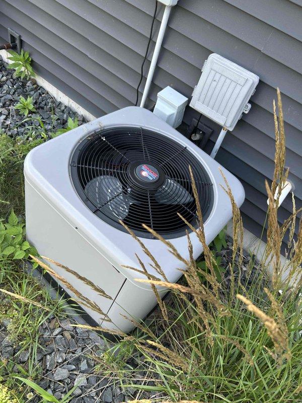 Performed comprehensive AC tune-up on 5-year-old residential air conditioning system. Cleaned outdoor condenser coil and inspected electrical connections at condensing unit. Performed drain line blow-through and replaced filter. System operating properly with no deficiencies identified at time of service.