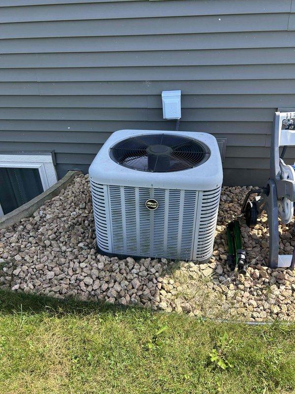 Performed comprehensive AC tune-up on residential cooling system. Outdoor condenser coil was found completely plugged with debris and was thoroughly cleaned and rinsed to restore proper airflow. Electrical components inspected with no issues identified. Furnace filter was severely clogged and had been pulled into the blower assembly; replaced filter with homeowner-supplied unit. Upon system startup, temperature split was inadequate, prompting refrigerant charge verification. Gauges confirmed system was low on refrigerant. Communicated findings to occupant present at property for relay to homeowners, explaining the low refrigerant condition and need for recharge. Added refrigerant to system to restore proper cooling capacity.