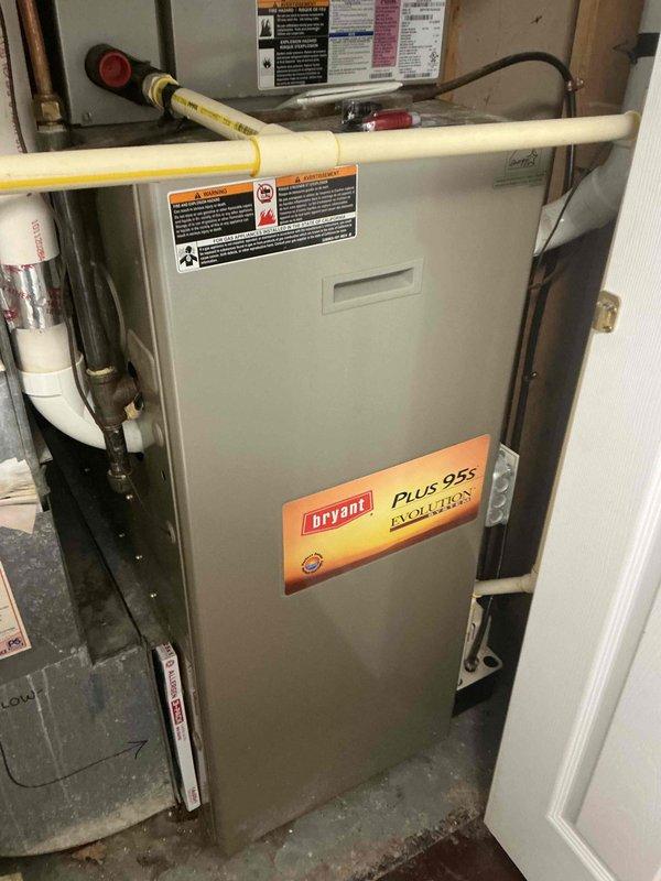 Performed comprehensive AC tune-up and inspection on 15-year-old Bryant system. All major components tested satisfactory including capacitor, contactor, refrigerant charge, condenser coil, control board, blower wheel, and evaporator coil with temperature drop measuring 19 degrees within specification. Secondary heat exchanger showing evidence of combustion moisture; furnace filter clean but slightly restrictive; system not tagged and all findings and options reviewed with occupant.