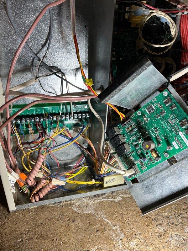 Replaced control board on heat pump air handler due to system malfunction. After installation, discovered the new board exhibited the same issue as the original, failing to send 24V signal to the outdoor condensing unit. Implemented temporary solution by directly wiring the outdoor unit's thermostat wiring to the thermostat terminals on the control board, restoring cooling operation while both boards remain installed pending further diagnosis.