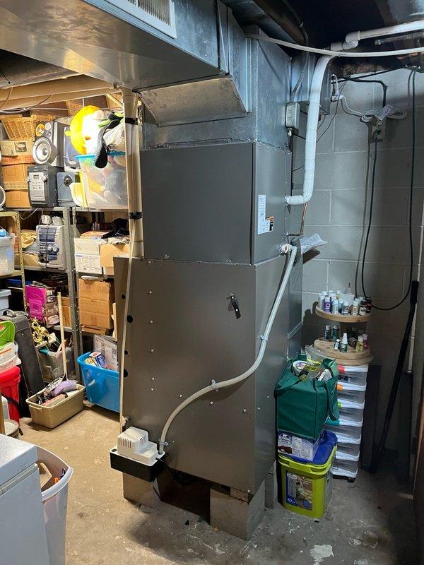 Performed annual air conditioning tune-up on 4-year-old Lennox system with customer reporting excessive noise from outdoor unit. Inspected indoor components including blower motor and evaporator coil, both found clean and operating within specifications with proper drainage. Conducted routine inspection of outdoor unit and discovered heavily plugged condenser coil restricting airflow and causing operational noise. Cleaned condenser coil thoroughly and ran system through complete operational cycle for 15 minutes. Verified system performance with 18-degree temperature split across evaporator coil and confirmed significant reduction in outdoor unit noise levels, with all components now functioning properly.