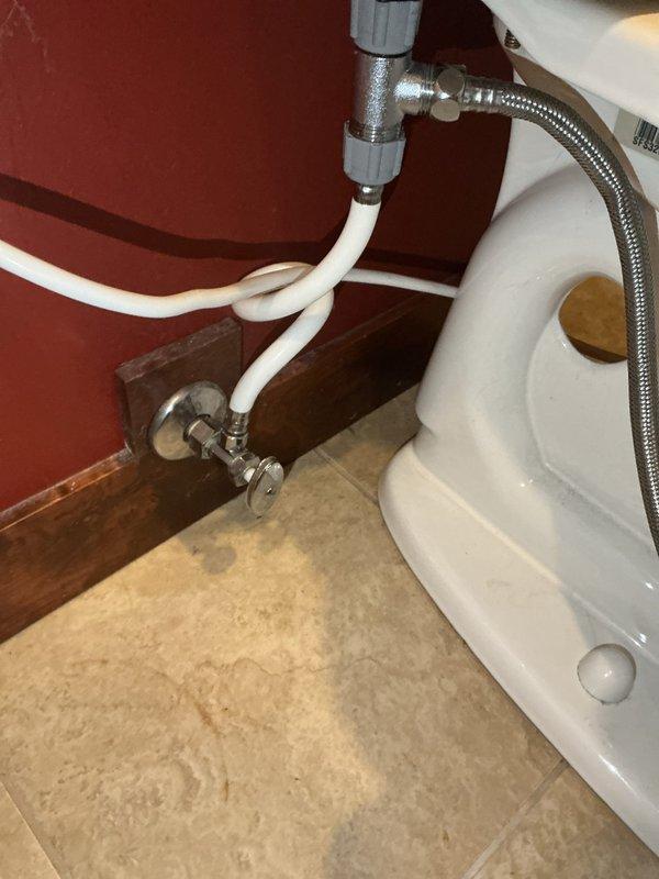 Responded to basement toilet leaking issue where homeowner attempted DIY repair of flapper and refill valve assembly without success. Upon arrival, found toilet components improperly installed with persistent leak from tank. Performed complete rebuild of toilet mechanism, including proper installation and adjustment of fill valve, flush valve assembly, and flapper system. Reconnected refill tube to overflow pipe, verified all compression fittings and supply line connections were secure, and tested system for proper operation and water seal integrity.