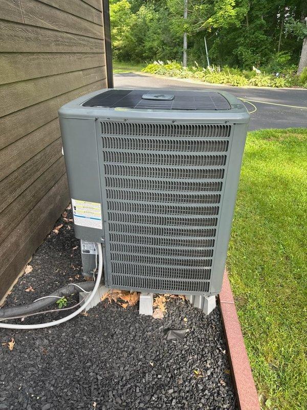 Responded to no cooling condition on 5-year-old heat pump system. Upon inspection, discovered rodent damage to compressor wiring causing high amperage draw and system failure. Repaired damaged wiring where possible and restored cooling operation. Performed routine maintenance including condenser coil cleaning, condensate drain clearing, and provided replacement air filter. Identified crankcase heater wiring damaged beyond repair due to rodent activity at connection point near heater element, requiring full crankcase heater replacement. System tested and operational with cooling restored, pending crankcase heater replacement recommendation.