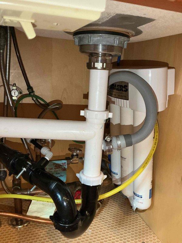 Responded to emergency water leak in laundry room where cold water supply line to laundry tub faucet had burst during early morning hours, causing water to spray into multiple rooms before main water shutoff. Upon investigation of the under-sink plumbing assembly, located the failed cold water supply line and replaced both hot and cold water supply lines to the laundry tub faucet to ensure system integrity and prevent future failures.
