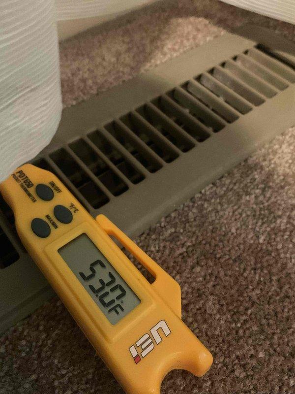 Responded to warranty callback for insufficient cooling in one bedroom of recently installed HVAC system. Measured supply air temperature at floor register, confirming output of 52-53°F. Assessed airflow distribution and determined room has only one return air grille for its size, resulting in inadequate air circulation and heat removal. Recommended installation of additional return air vent to improve air exchange and cooling performance in affected bedroom.