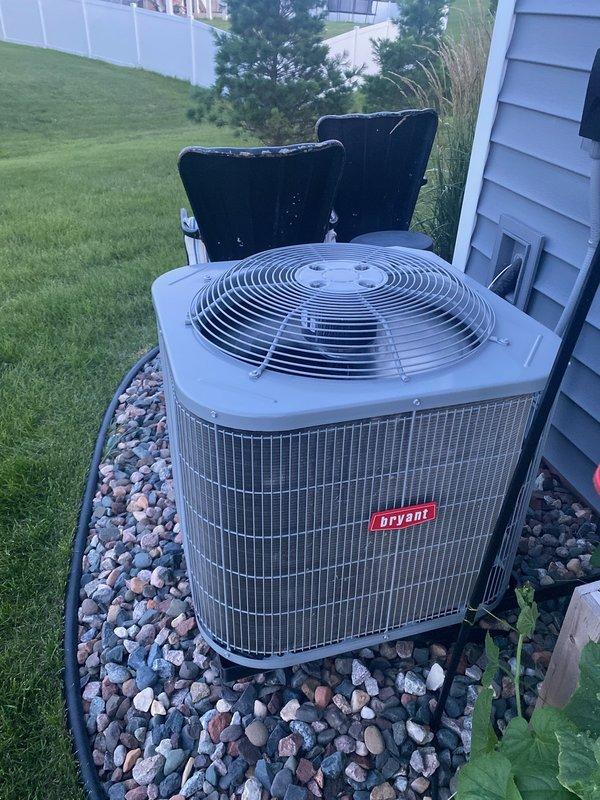 Responded to service call for 2-year-old Bryant AC system experiencing inadequate cooling with uneven temperature distribution—main floor reading 75-79°F while thermostat set to 73°F. Performed comprehensive diagnostic evaluation of system components including thermostat functionality, air handler operation, blower motor performance, and air filter condition, all of which tested within normal parameters. Measured temperature split across evaporator coil and found only 11-degree differential, indicating insufficient cooling capacity.

Inspected outdoor condensing unit and found condenser coil slightly dirty but acceptable. Conducted refrigerant pressure analysis revealing abnormally high suction pressure and elevated subcooling readings, suggesting potential system overcharge condition. Factory refrigerant charge specification is 4 pounds for this unit. Recovered approximately 3 pounds 11 ounces of R-410A refrigerant and recharged system with recovered amount to maintain proper charge l