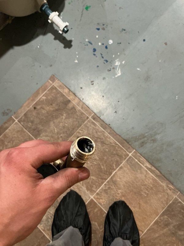 Responded to a no-hot-water call on a three-year-old A.O. Smith electric water heater. Upon inspection, discovered the top heating element was burnt out and melted, with evidence of a fried electrical line in the reset button compartment. Verified incoming power supply at 240V to confirm electrical service was adequate. Replaced the entire 50-gallon A.O. Smith water heater under manufacturer warranty due to the extent of the electrical damage to the upper element assembly. Following installation, tested voltage at the unit and verified proper operation of both heating elements. System restored to full functionality with hot water production confirmed.
