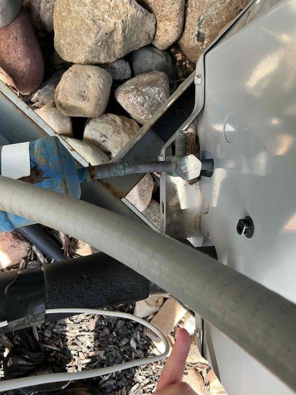 Performed comprehensive A/C tune-up on outdoor condensing unit. Upon inspection, discovered low refrigerant level and missing service port caps. Recharged system to manufacturer specifications using recovery equipment and installed locking caps on service ports to prevent future refrigerant loss and contamination. Unit operating within normal parameters upon completion.