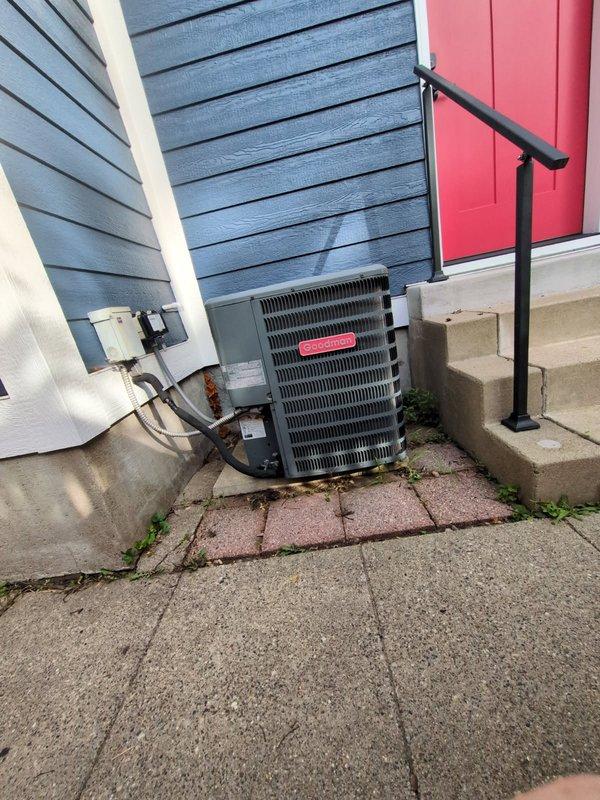 Responded to no cooling complaint on 7-8 year old central air conditioning system. Upon arrival, found furnace blower fan and condenser fan motor operating, but compressor not running. Diagnosed failed dual run capacitor with compressor side reading 7/40 microfarads (should be 40) and fan side reading 5.09/5 microfarads. Replaced defective dual run capacitor with new 40/5 microfarad unit. Verified system operation by checking refrigerant pressures, amp draws, air filter condition, and temperature drop across evaporator coil. All parameters within normal operating range. System restored to proper cooling operation.