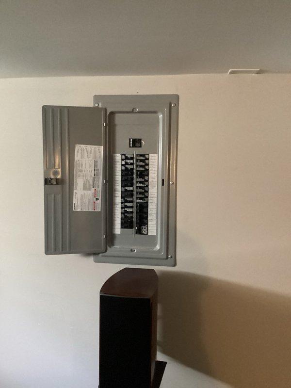 Responded to no cooling complaint on 7-8 year old central air conditioning system. Upon arrival, found furnace blower fan and condenser fan motor operating, but compressor not running. Diagnosed failed dual run capacitor with compressor side reading 7/40 microfarads (should be 40) and fan side reading 5.09/5 microfarads. Replaced defective dual run capacitor with new 40/5 microfarad unit. Verified system operation by checking refrigerant pressures, amp draws, air filter condition, and temperature drop across evaporator coil. All parameters within normal operating range. System restored to proper cooling operation.
