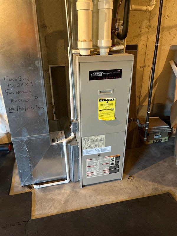 Responded to no cooling call on approximately 17-year-old HVAC system. Upon arrival, diagnosed failed blower motor preventing air circulation through the Lennox iComfort Elite Dimension furnace unit. Customer consulted with home warranty provider who determined repair was not covered under their policy. Proceeded with blower motor replacement, installing new motor assembly and verifying proper electrical connections. Tested complete system operation to confirm restored airflow and proper cooling function. Equipment returned to normal operation with adequate air delivery throughout the home.