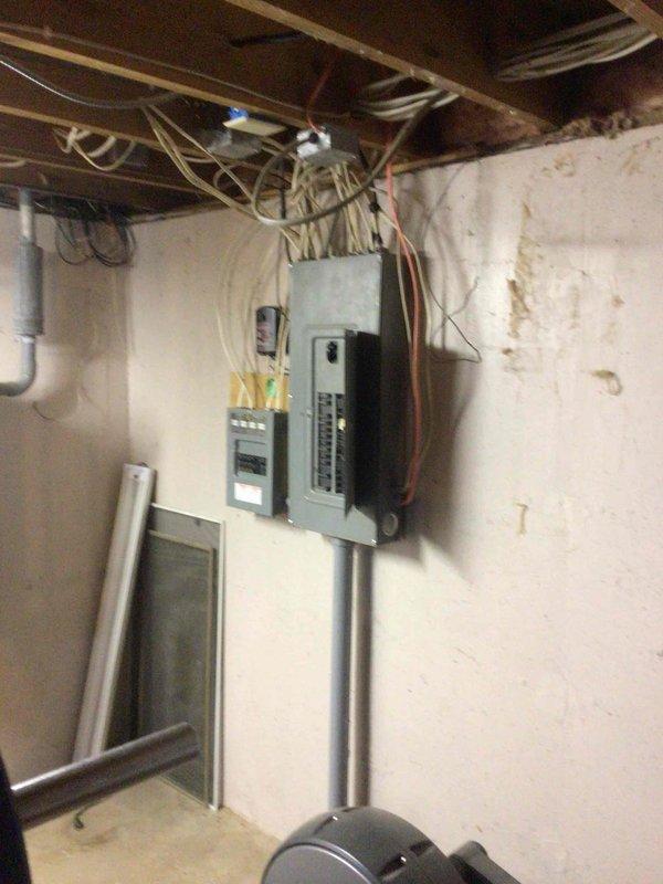 Responded to service call for water leaking from bottom of air handler unit. Upon inspection, found condensate drain line partially clogged, causing water to accumulate in drain pan. Cleared blockage from condensate line and verified complete drainage of pan. Customer reported APCO-X UV light system not functioning. Tested transformer output and found no 24-volt power supply. Replaced defective transformer and confirmed proper voltage restoration. UV light still inoperative after transformer replacement. Removed UV bulb and discovered glass envelope shattered at base. Ordered replacement UV bulb for future installation.