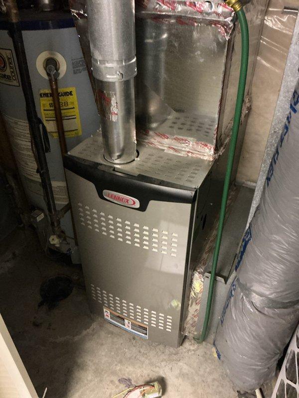 # HVAC Maintenance and Repair Summary

Responded to a no-cooling complaint on a 14-year-old residential air conditioning system installed with an indoor coil positioned atop a newer Lennox furnace. Upon inspection, identified multiple failing components presenting immediate operational concerns and potential secondary damage risks.

## Diagnostic Findings

Comprehensive system evaluation revealed several critical issues requiring immediate attention. The contactor displayed signs of electrical degradation with visible pitting and arcing damage. Capacitor testing indicated values outside manufacturer specifications, contributing to reduced system performance. Condenser fan motor exhibited bearing wear and elevated operating temperatures. Compressor amperage readings measured significantly above nameplate specifications, indicating mechanical stress and potential imminent failure.

System airflow analysis identified a restriction in the refrigerant circuit. The thermal expansion valve (T