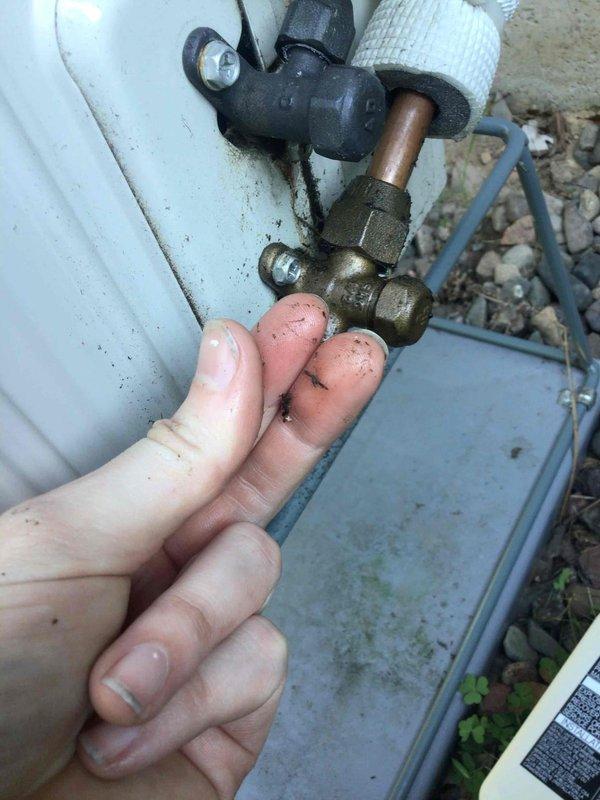 Responded to no cooling complaint on 2-year-old mini split system. Found indoor and outdoor units running but system not providing cooling to space. Upon inspection, discovered complete refrigerant loss due to leak at outdoor unit flared connection fitting. Brass service valve and flare fitting showed improper installation with visible signs of refrigerant leak at connection point. System was operational but unable to cool due to zero refrigerant charge. Created installation correction documentation for repair team to return, properly remake flared connection, pressure test system, and recharge to factory specifications. Customer notified that office will schedule follow-up appointment for corrective work.