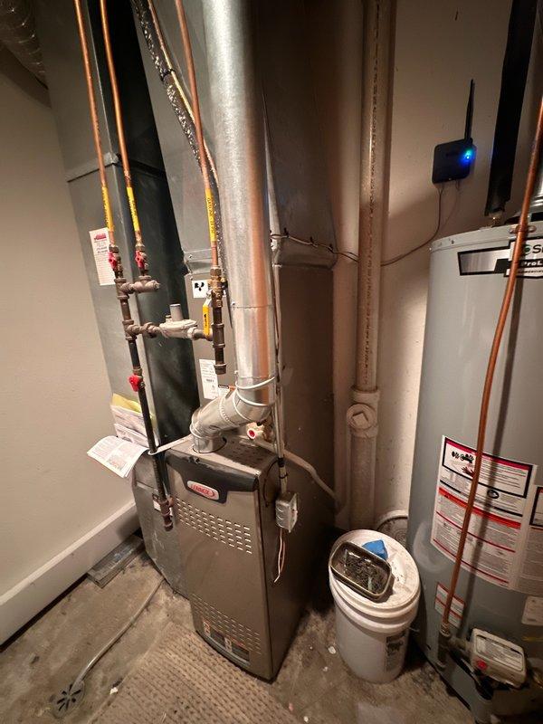 Responded to no cooling complaint on 4-year-old residential HVAC system unable to maintain setpoint below 79°F. Diagnosed refrigerant leak at evaporator coil requiring replacement. Found outdoor condenser coil completely blocked with debris and vegetation; performed coil cleaning to restore temporary airflow and heat transfer. System operational short-term but evaporator coil replacement needed immediately to prevent complete system failure.